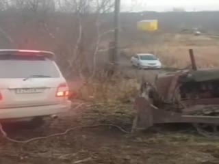 Завели трактор с толкача